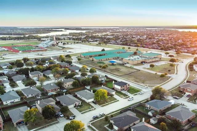 an aerial view of residential houses with outdoor space