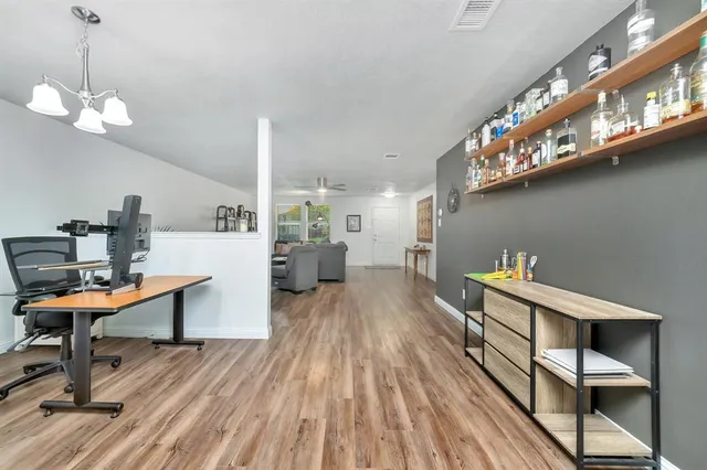 a room with furniture and wooden floor