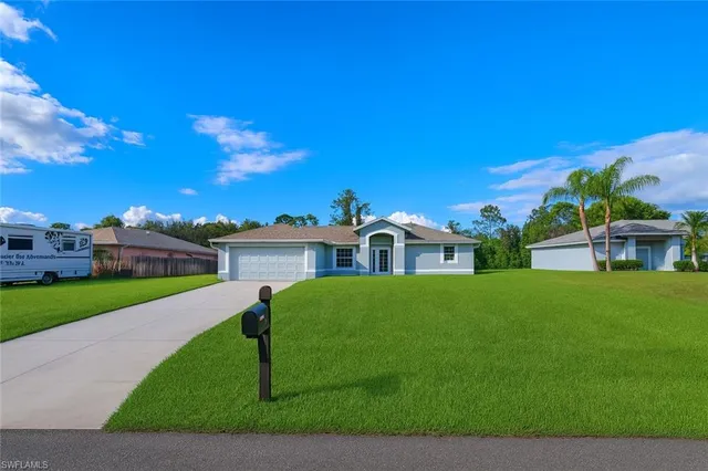 an aerial view of a house with a garden