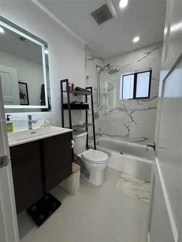 a view of backyard with cabin