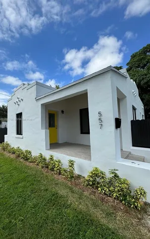 a house view with a backyard space