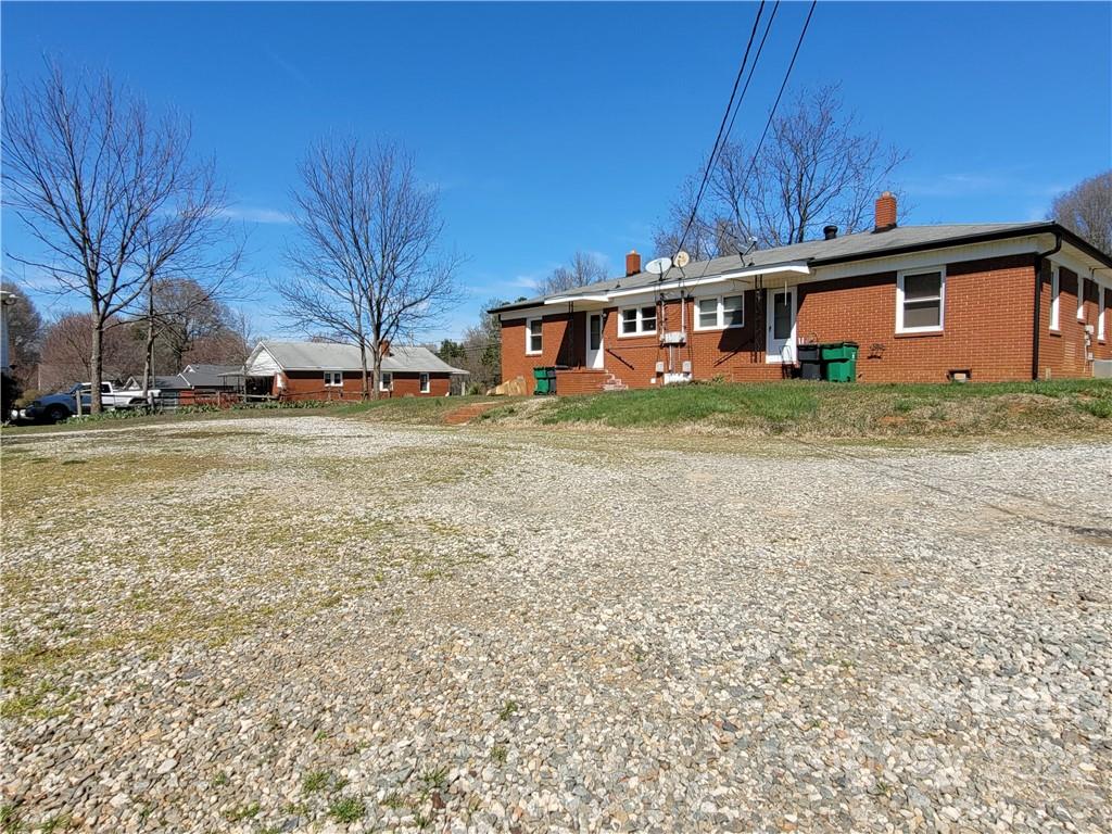 2123 Oakdale Road Charlotte, NC 28216 - Photo 11 of 13 a front view of a house with a yard