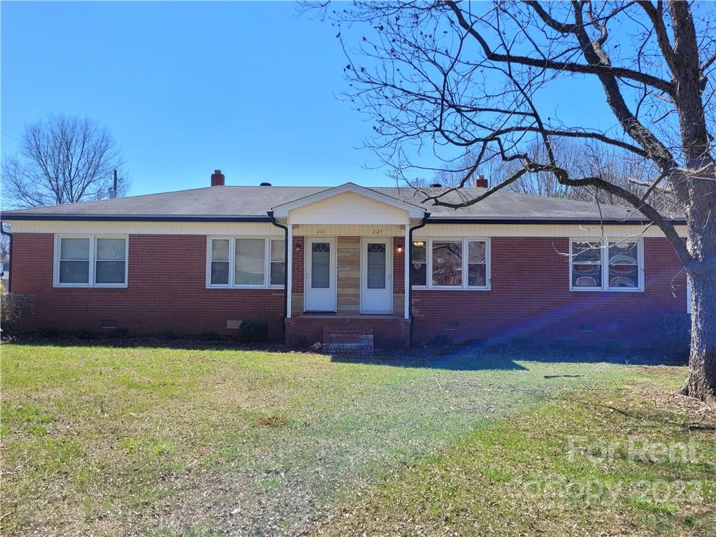 2123 Oakdale Road Charlotte, NC 28216 - Photo 13 of 13 a front view of a house with yard and green space