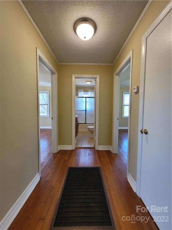 2123 Oakdale Road Charlotte, NC 28216 - Photo 6 of 13 a view of gallery with wooden floor