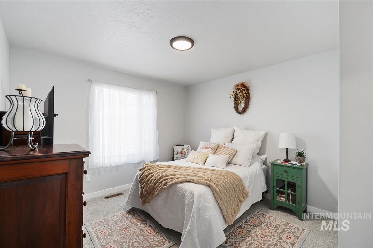 11359 West Langit Street Star, ID 83669 - Photo 17 of 39 Bedroom with light colored carpet