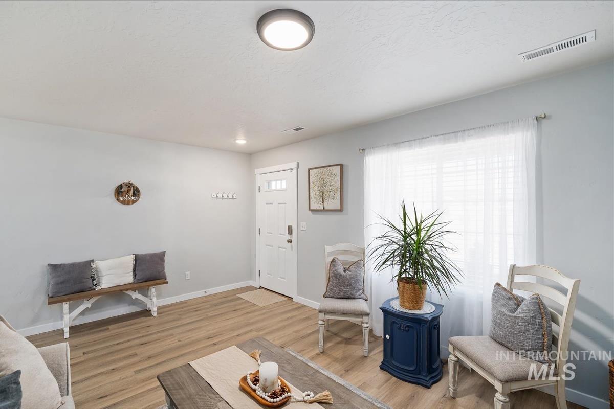 11359 West Langit Street Star, ID 83669 - Photo 2 of 39 Living room with light wood finished floors