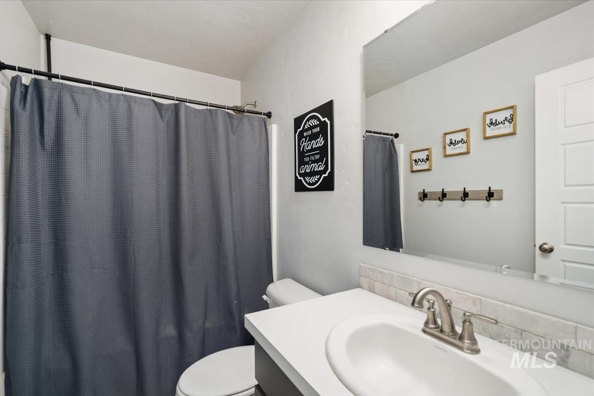 11359 West Langit Street Star, ID 83669 - Photo 21 of 39 Bathroom with vanity and a shower with shower curtain