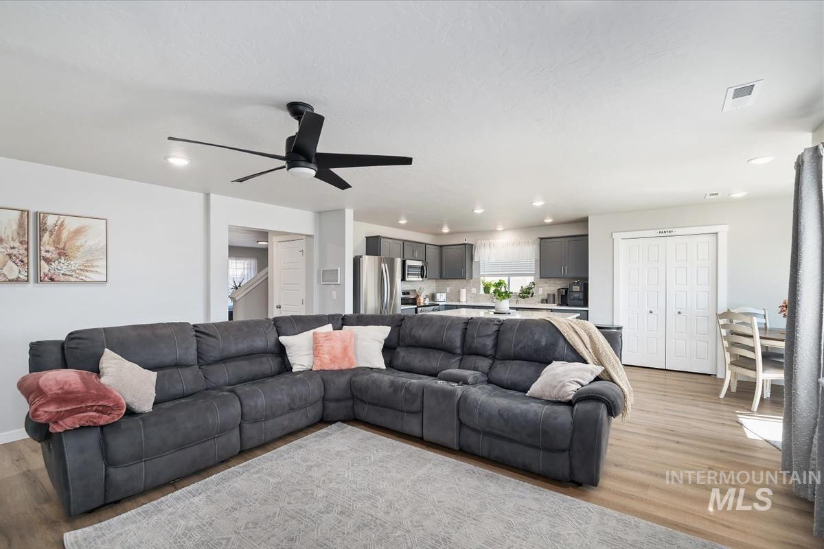 11359 West Langit Street Star, ID 83669 - Photo 23 of 39 Living room featuring light wood-type flooring, ceiling fan, and recessed lighting