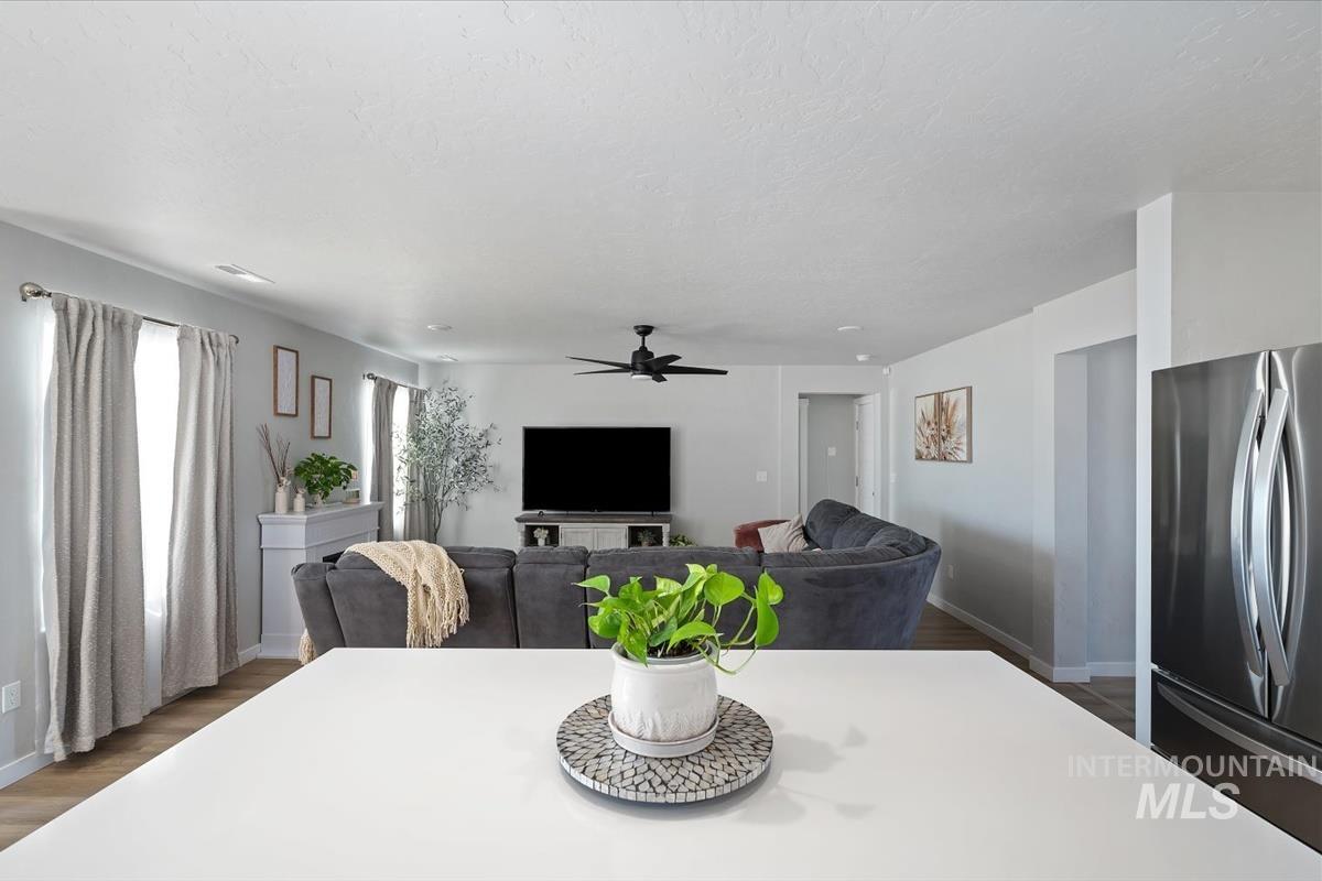 11359 West Langit Street Star, ID 83669 - Photo 26 of 39 Dining room featuring dark wood-type flooring and a ceiling fan