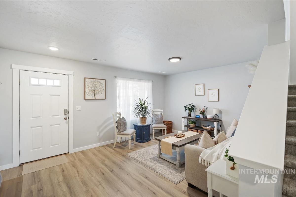 11359 West Langit Street Star, ID 83669 - Photo 3 of 39 Foyer featuring light wood finished floors and stairway