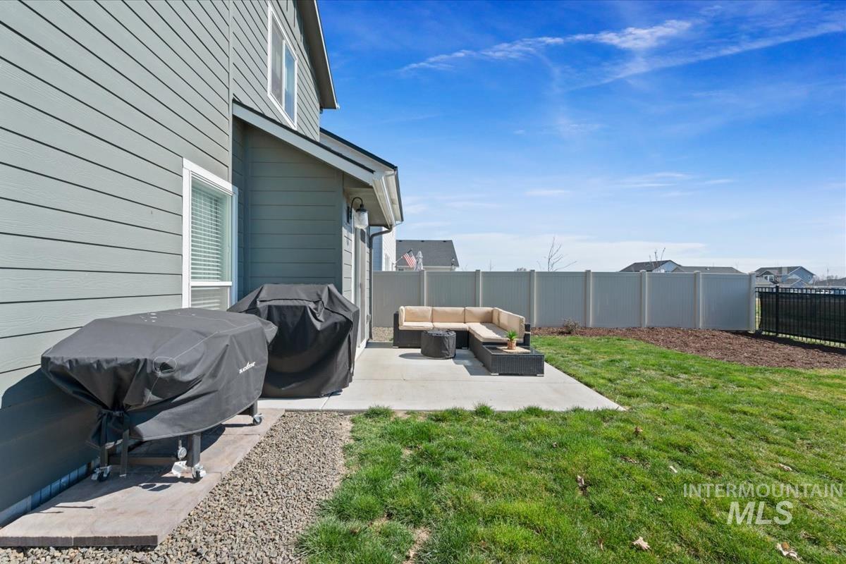 11359 West Langit Street Star, ID 83669 - Photo 32 of 39 Fenced backyard featuring a patio area and outdoor lounge area