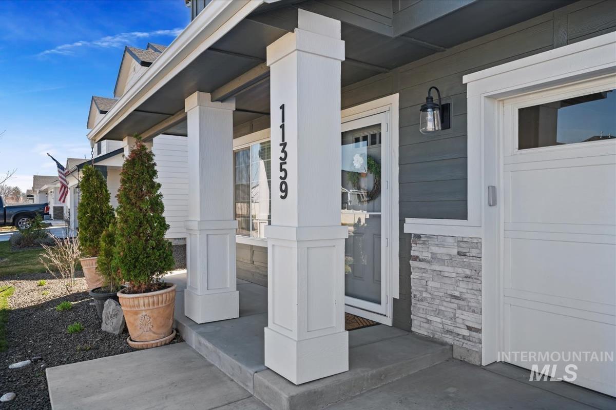 11359 West Langit Street Star, ID 83669 - Photo 37 of 39 Doorway to property with covered porch and stone siding
