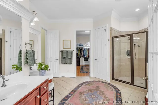 a spacious bathroom with a double vanity sink shower and a mirror