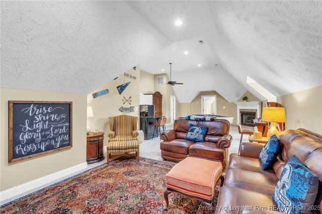 a bedroom with a bed and large windows