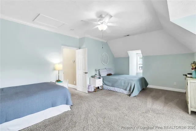 a bedroom with furniture and a chandelier
