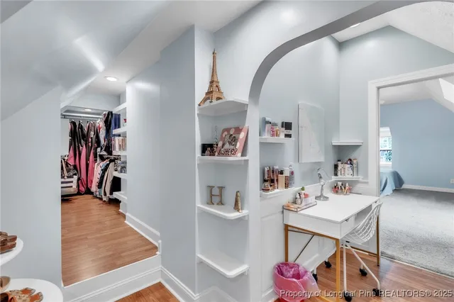 a front view of a house with swimming pool having outdoor seating