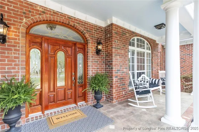 a front view of a house with outdoor seating