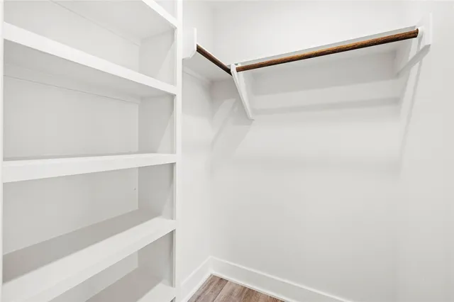 a view of an empty walk in closet
