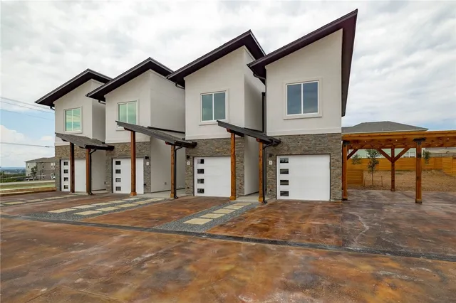a front view of a house with a garage