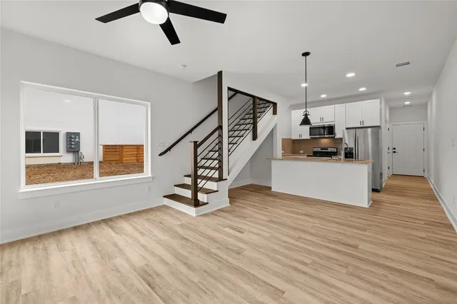 a view of kitchen with furniture and wooden floor