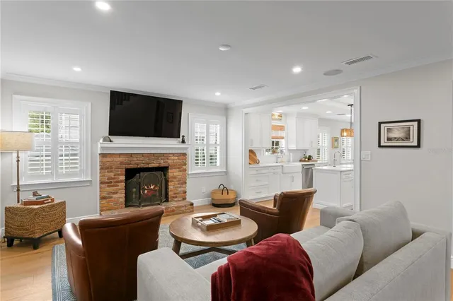 a living room with furniture kitchen view and a dining table