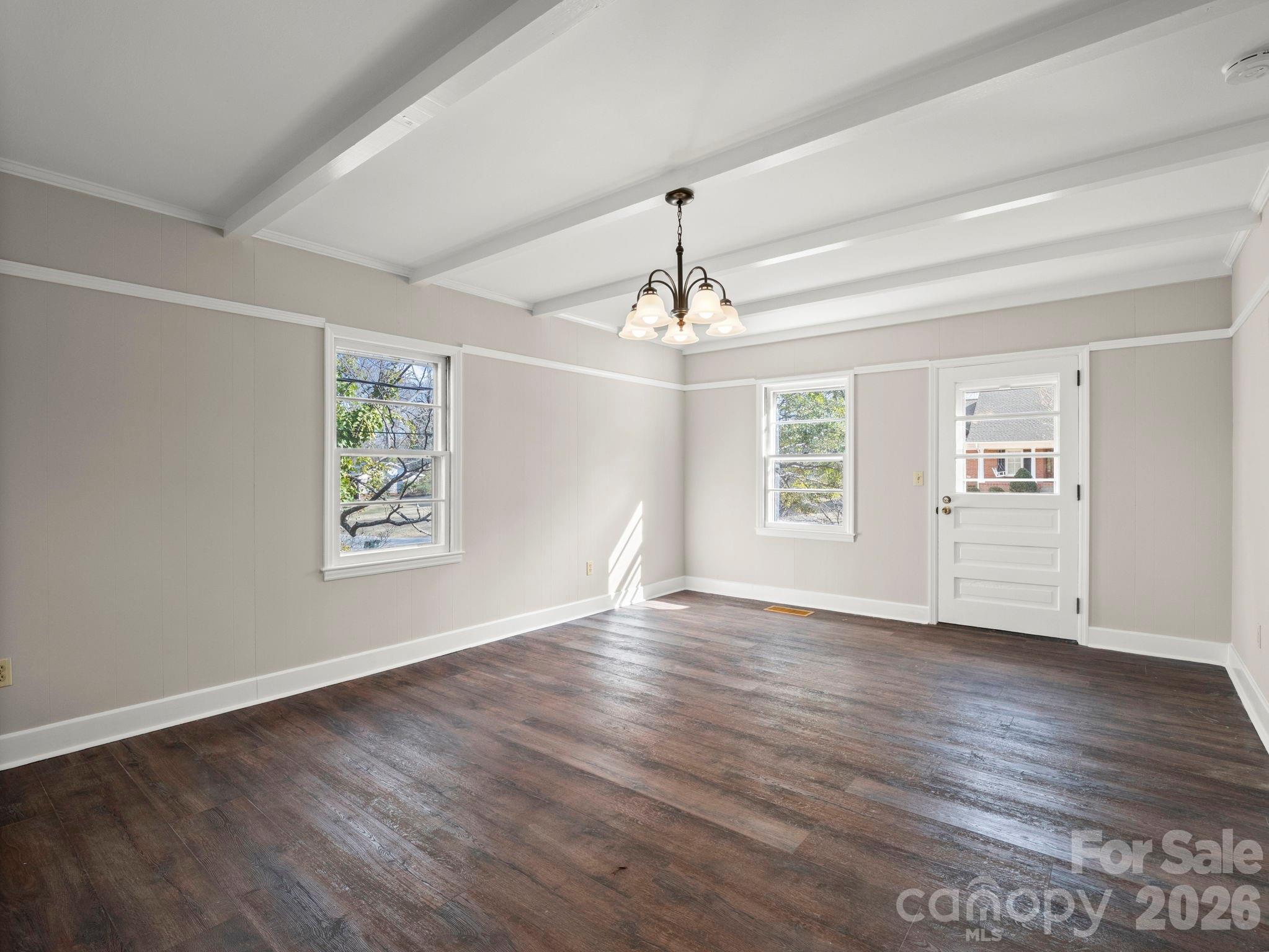 204 West Fernwood Drive Rutherfordton, NC 28139 - Photo 17 of 34 a view of an empty room with wooden floor and a window