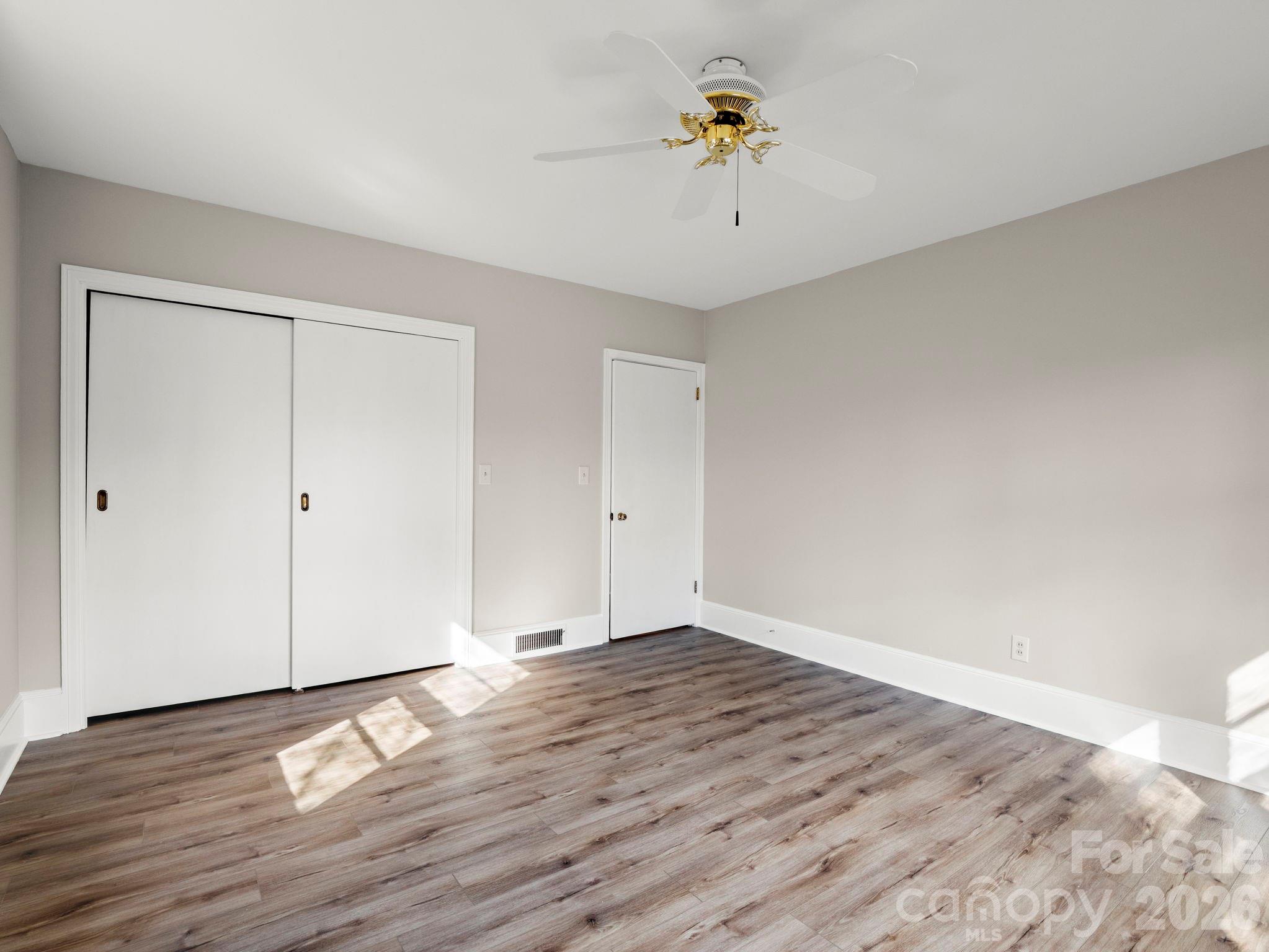 204 West Fernwood Drive Rutherfordton, NC 28139 - Photo 24 of 34 a view of an empty room with wooden floor