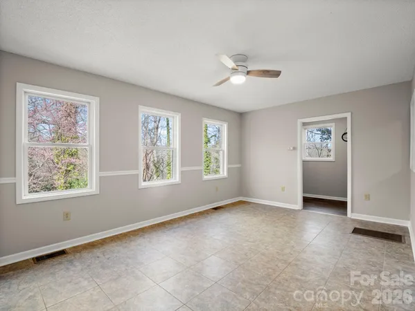 a view of an empty room with a window