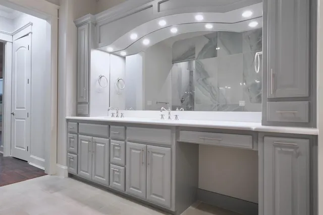 a bathroom with a double vanity sink and a mirror