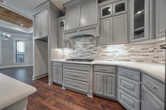 a kitchen with stainless steel appliances granite countertop a sink and cabinets