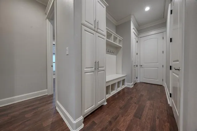 a view of hallway with wooden floor