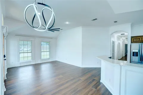 a view of a livingroom with wooden floor