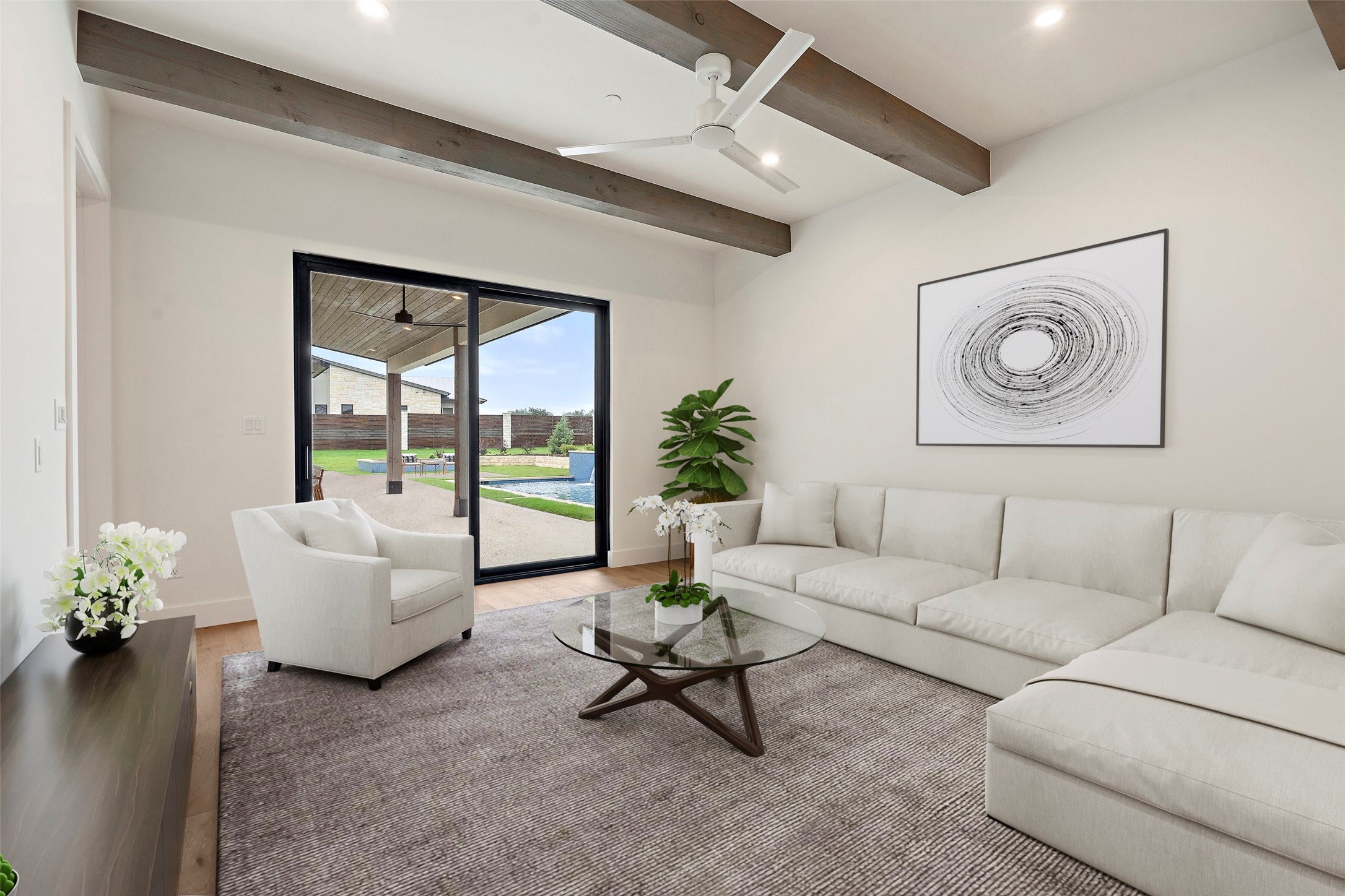 17212 Morning Grove Lane Austin, TX 78738 - Photo 24 of 38 a living room with furniture and a large window