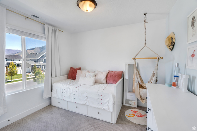 646 South Meade Street Mapleton, UT 84664 - Photo 15 of 46 Bright interior space featuring a large window, light-toned walls, and a ceiling-mounted light fixture