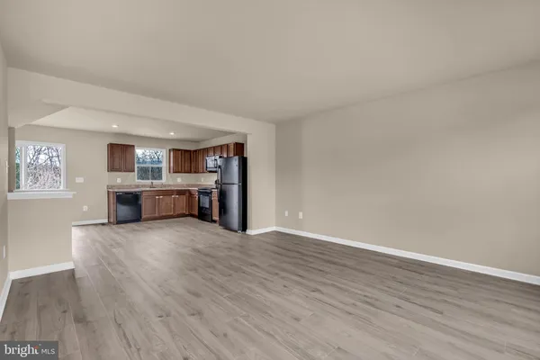 a view of kitchen with wooden floor