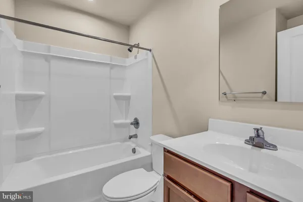 a bathroom with a sink a toilet and a bathtub