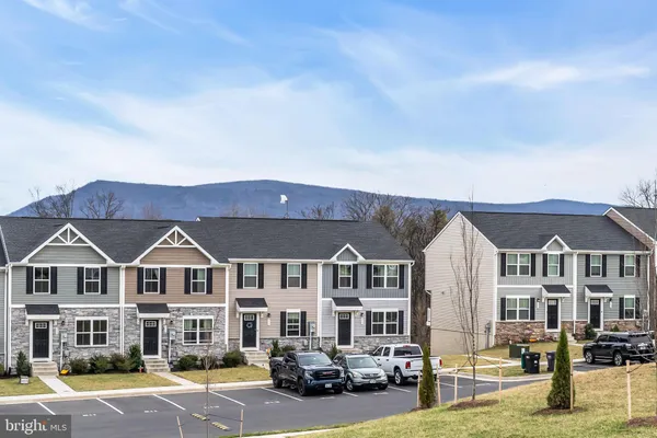 a view of multiple houses with a yard