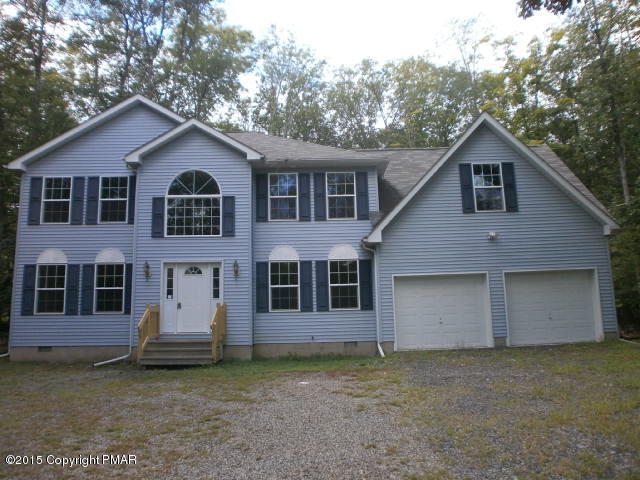 5643 Decker Road Bushkill, PA 18324 - Photo 1 of 12 a front view of a house with a yard