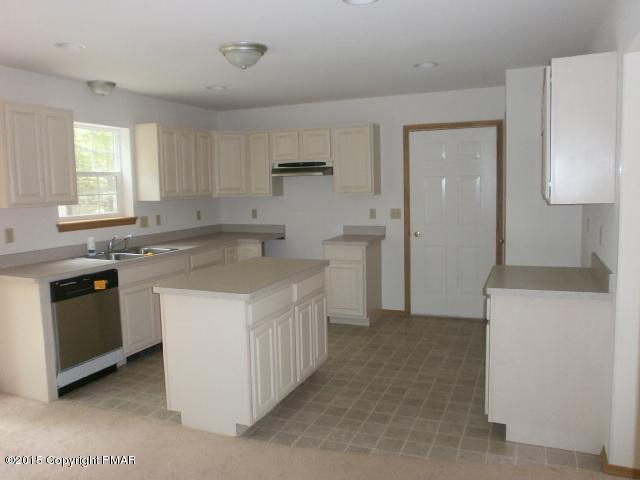 5643 Decker Road Bushkill, PA 18324 - Photo 3 of 12 a kitchen that has a sink and a stove in it