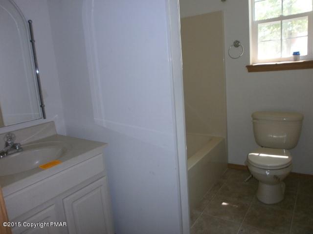 5643 Decker Road Bushkill, PA 18324 - Photo 10 of 12 a bathroom with a sink and a toilet