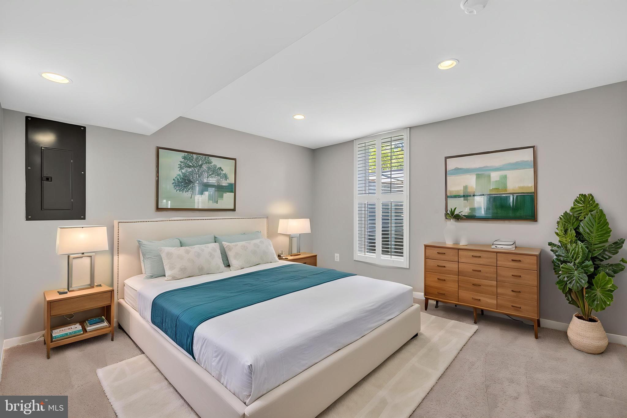 7518 Candytuft Court Springfield, VA 22153 - Photo 34 of 47 a bedroom with a bed and a couch