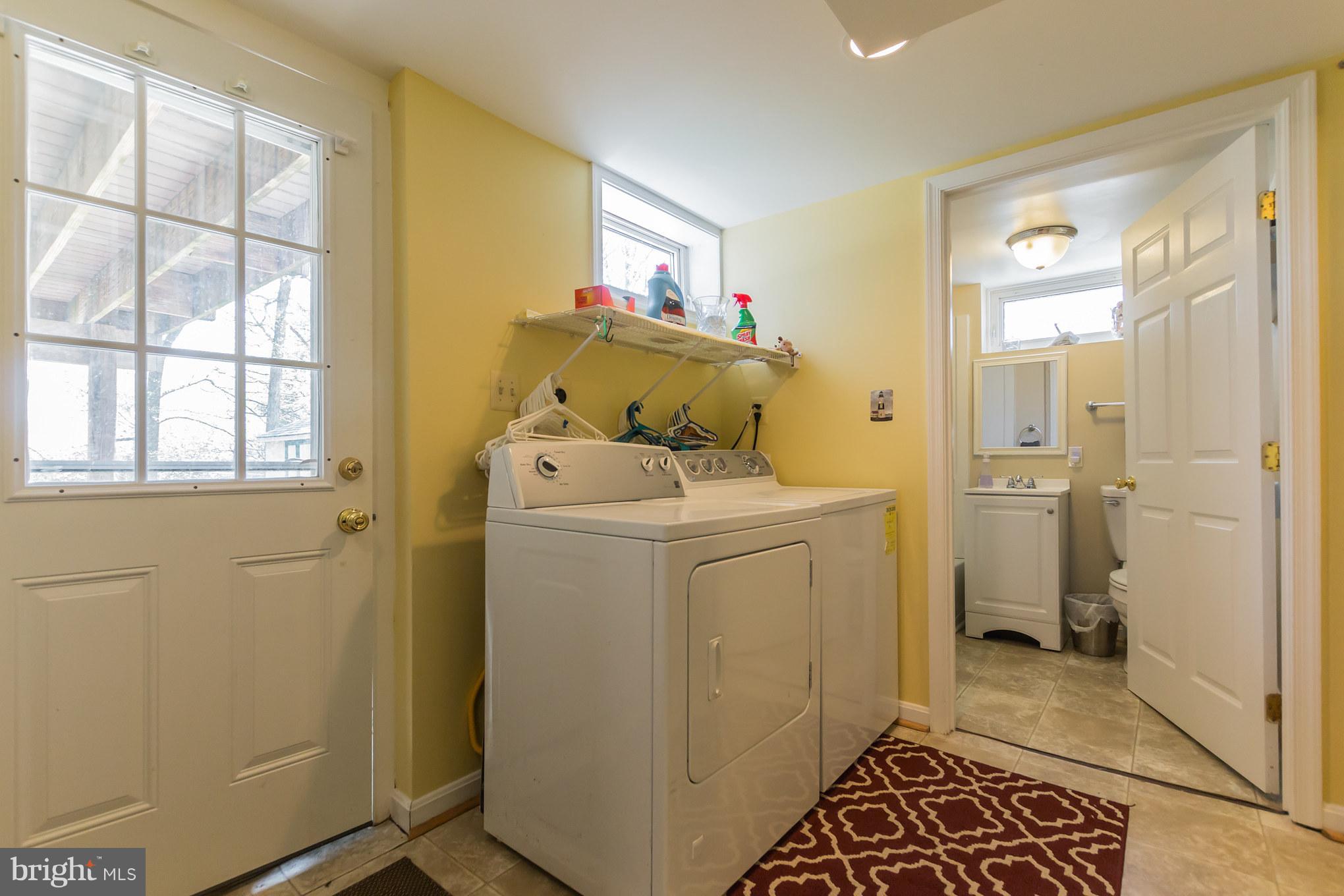 916 Snure Road Silver Spring, MD 20901 - Photo 26 of 30 Level Exit, Laundry Area, 2nd Full Bathroom