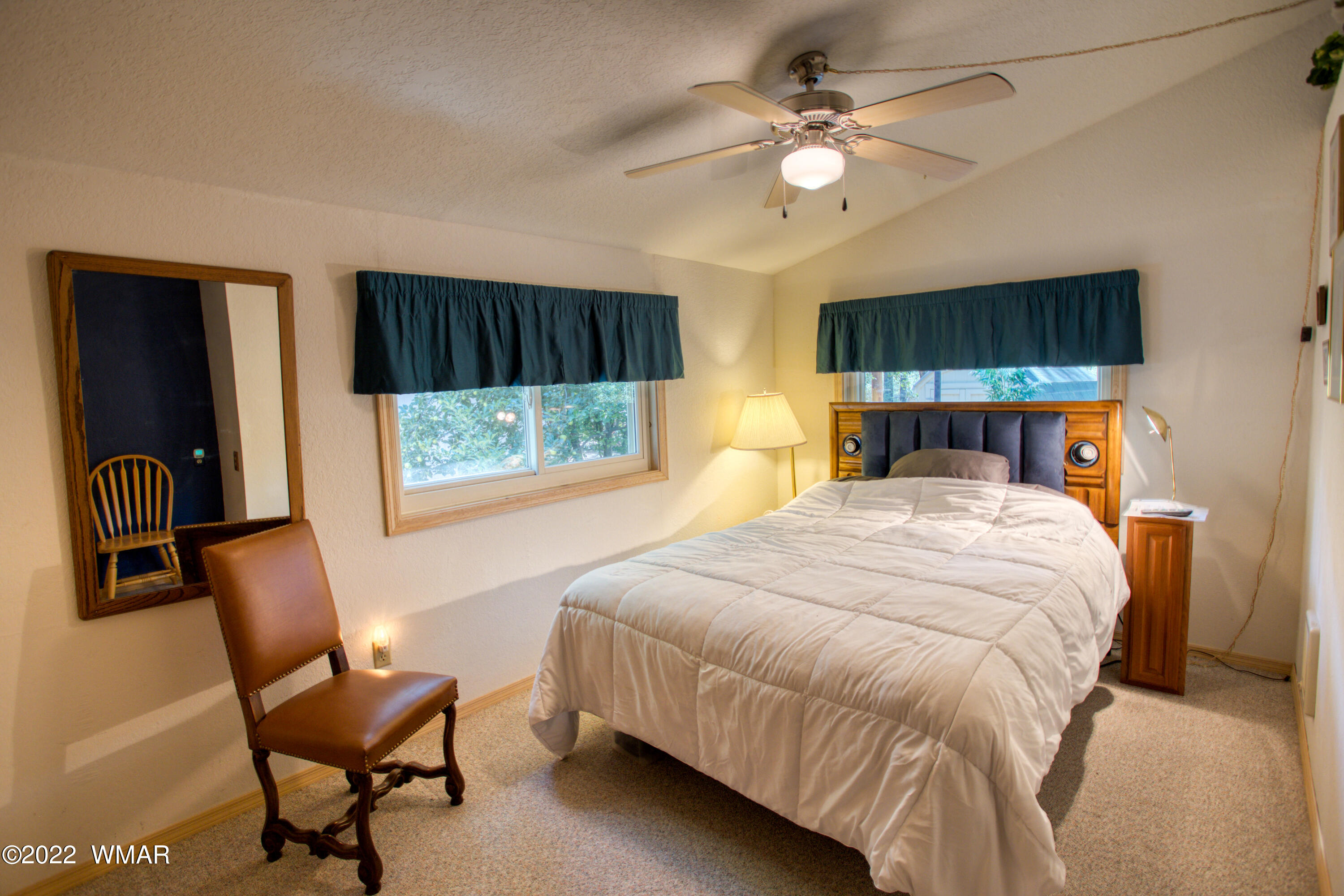5231 South Blue Ridge Loop Pinetop, AZ 85935 - Photo 11 of 26 a bed room with a bed and a chair