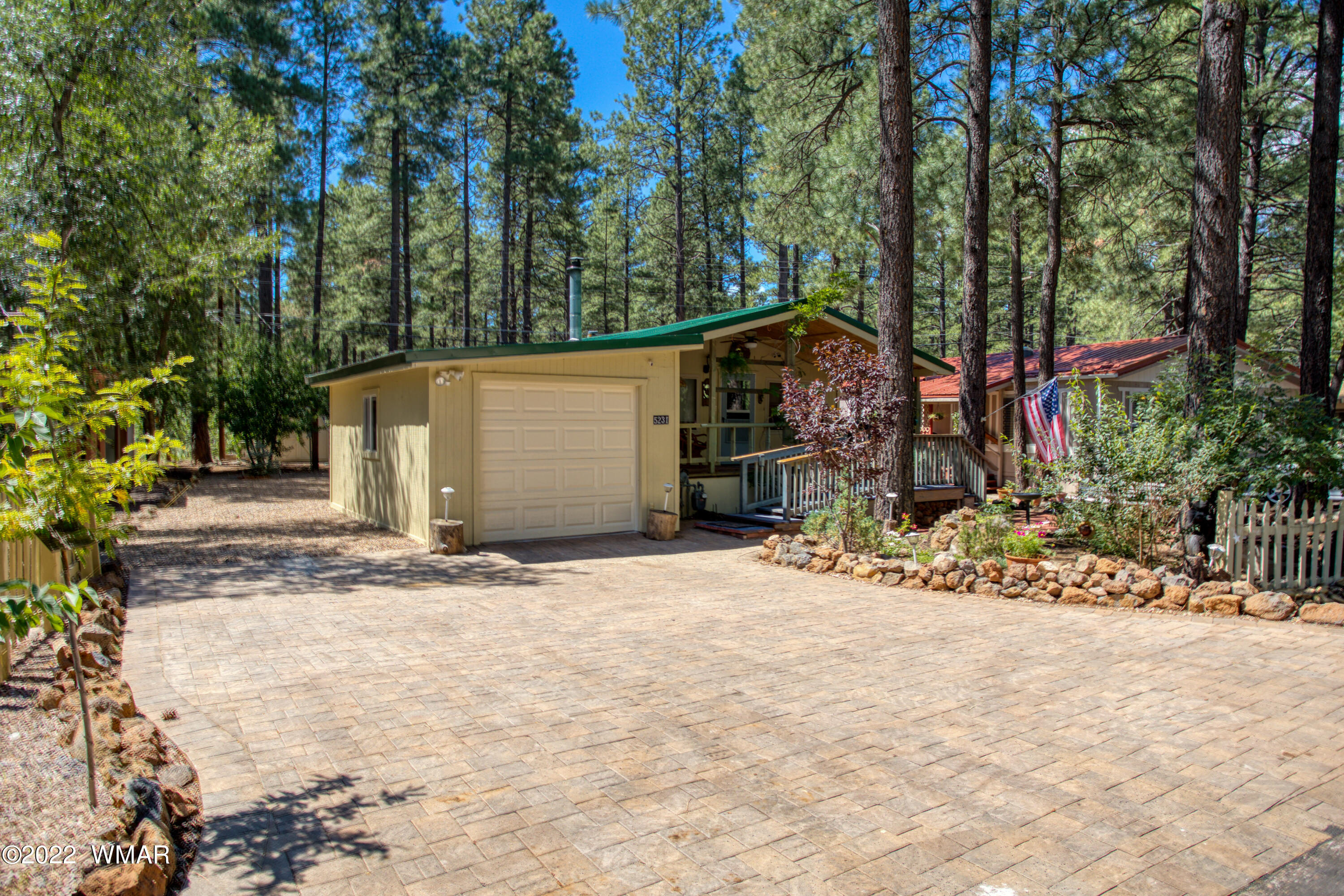 5231 South Blue Ridge Loop Pinetop, AZ 85935 - Photo 17 of 26 a view of a backyard with tree