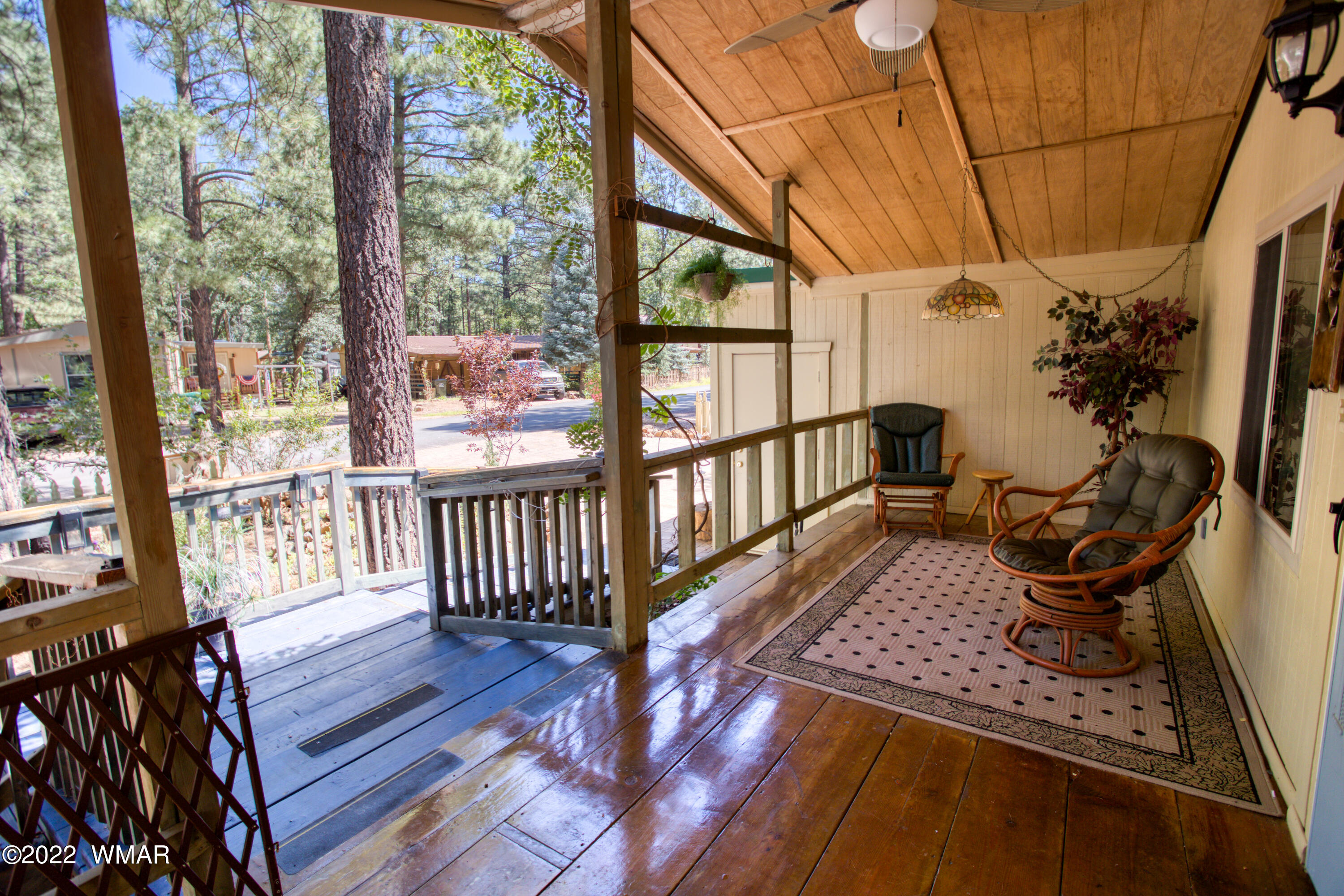 5231 South Blue Ridge Loop Pinetop, AZ 85935 - Photo 2 of 26 a view of a porch with wooden floor