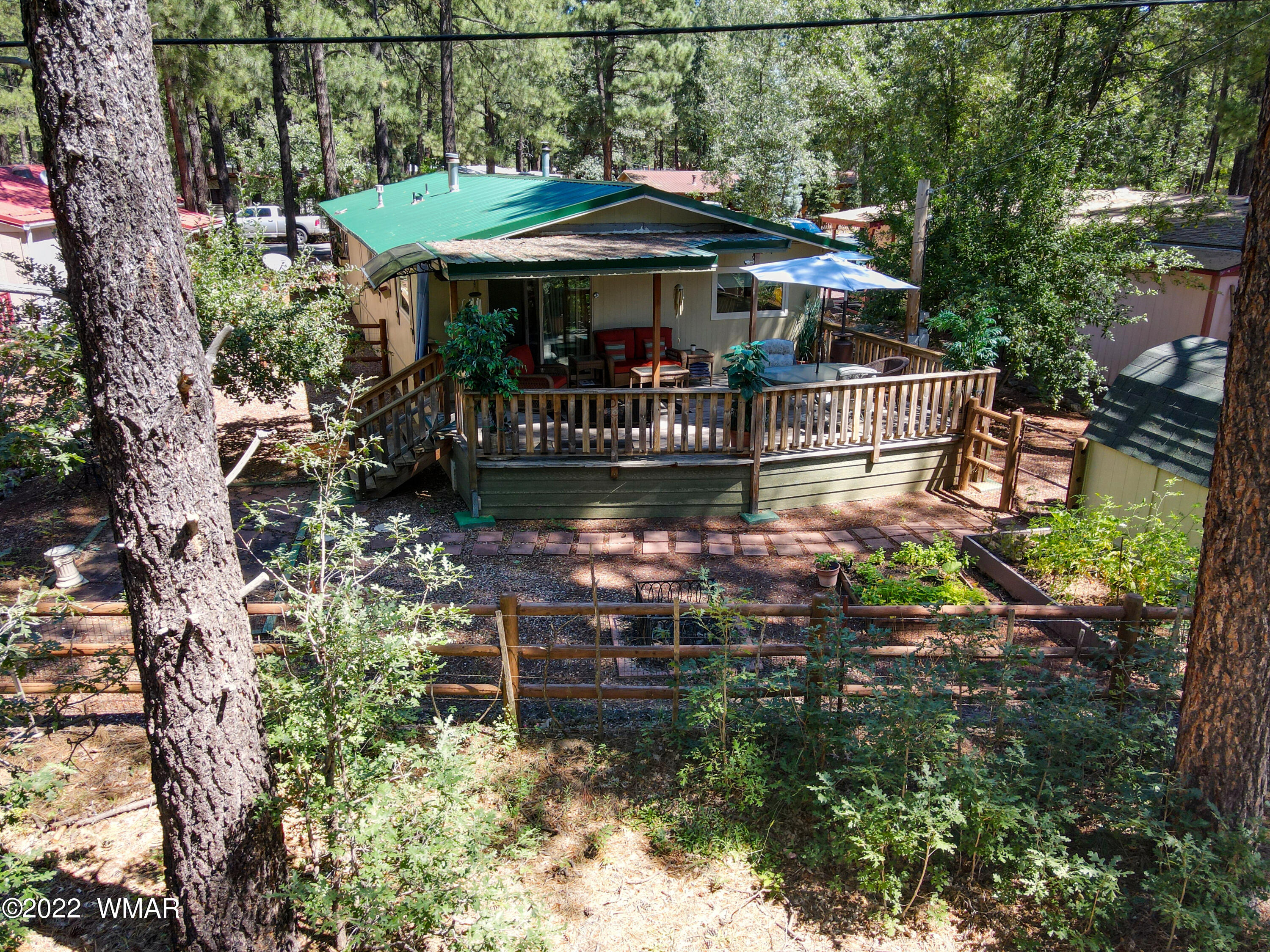 5231 South Blue Ridge Loop Pinetop, AZ 85935 - Photo 24 of 26 a view of a table and chairs under an umbrella