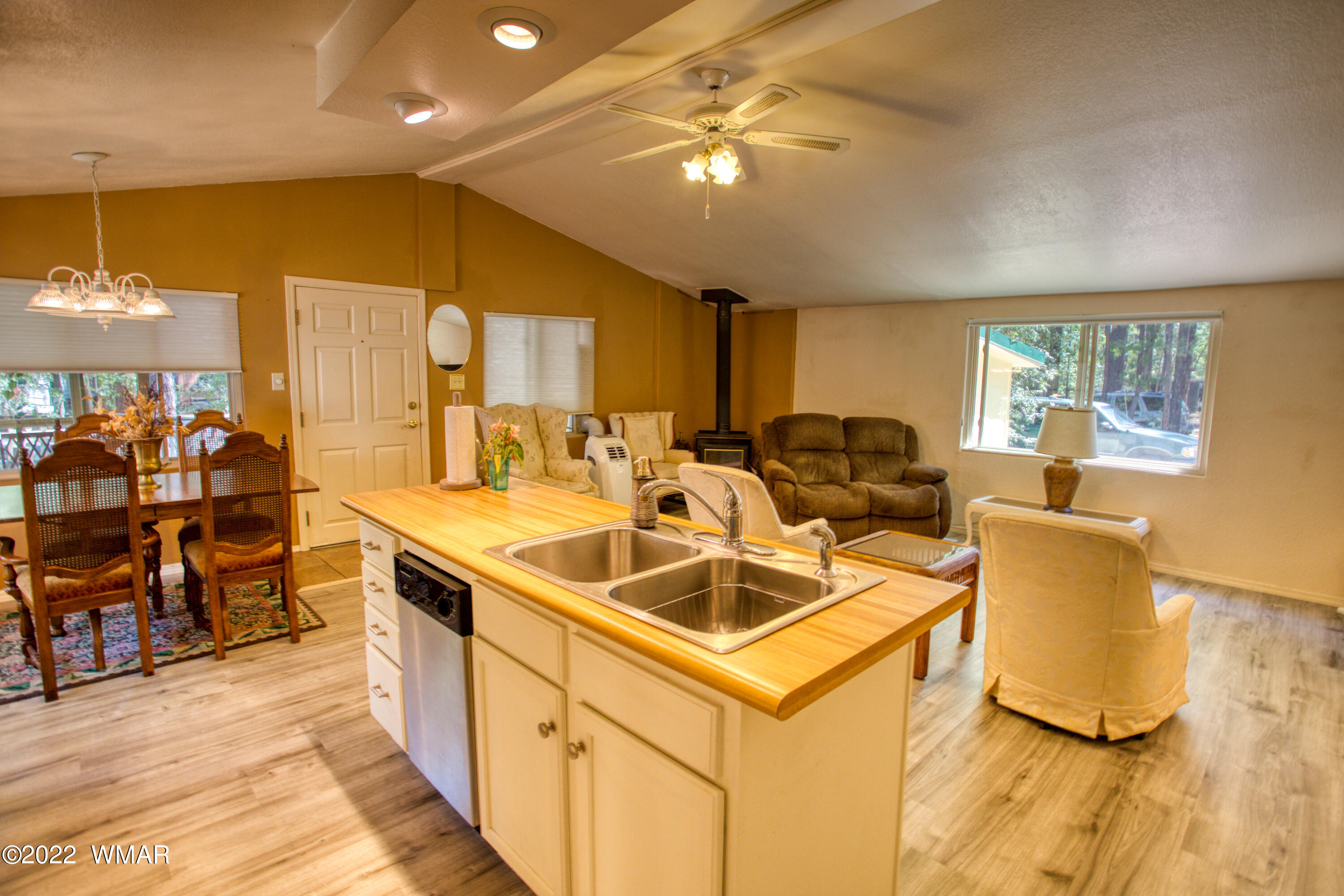 5231 South Blue Ridge Loop Pinetop, AZ 85935 - Photo 25 of 26 a view of a kitchen with kitchen island a sink a counter space and stainless steel appliances