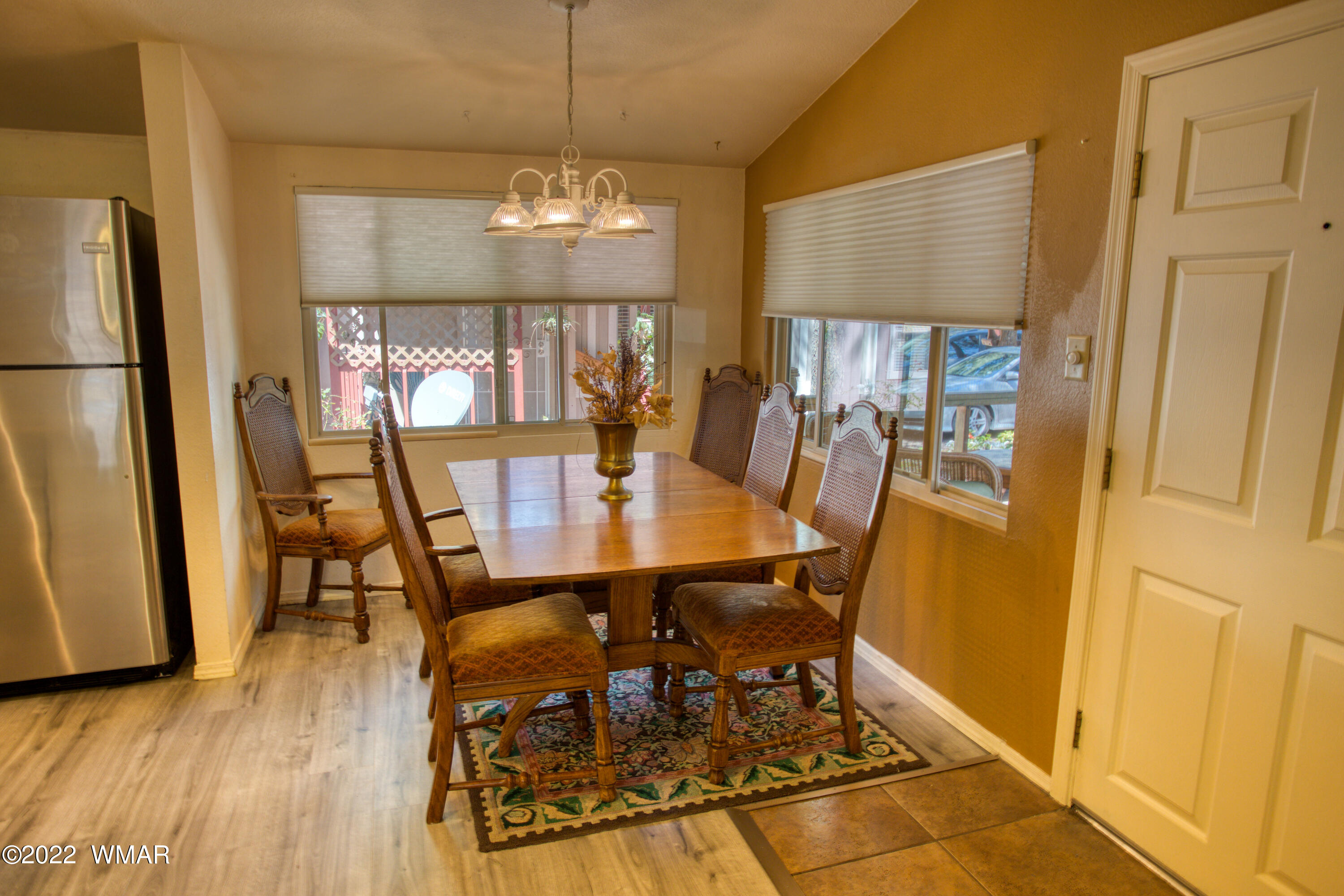 5231 South Blue Ridge Loop Pinetop, AZ 85935 - Photo 7 of 26 a view of a dining room with furniture and wooden floor