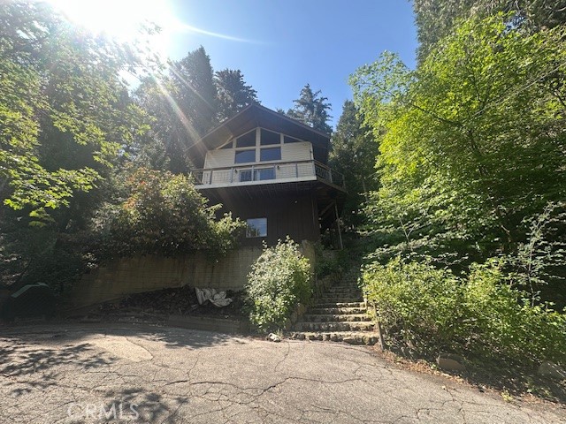 24027 Lakeview Drive Crestline, CA 92325 - Photo 2 of 15 a front view of a house with a yard