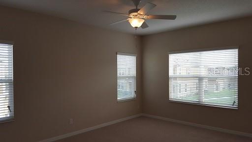 7652 Ripplepointe Way Windermere, FL 34786 - Photo 9 of 21 a view of a livingroom with a window